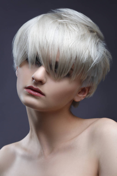 Beauty portrait of blonde woman with stylish short haircut. - Фото, изображение