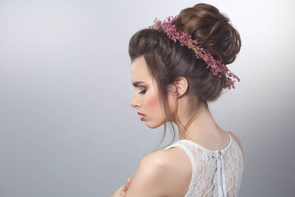 Beauty portrait of sexy bride with wreath of heather in hairstyle on gray background. - Zdjęcie, obraz