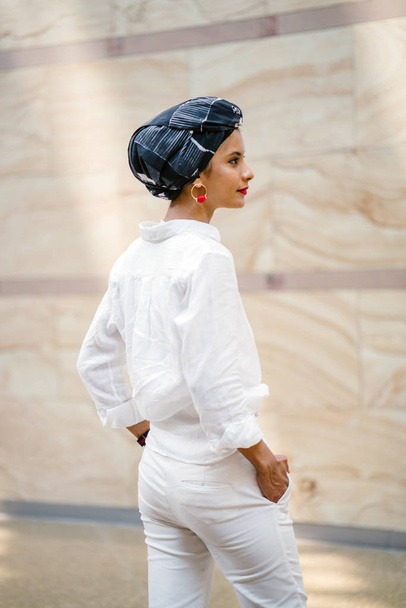 Portrait of a young Muslim woman wearing a turban (headscarf, hijab). She is elegant and  attractive - Фото, зображення