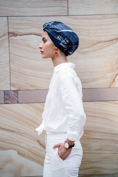 Portrait of a young Muslim woman wearing a turban (headscarf, hijab). She is elegant and  attractive - Foto, imagen