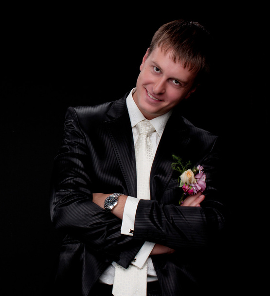 Smiling man in studio on a black background - Foto, Bild