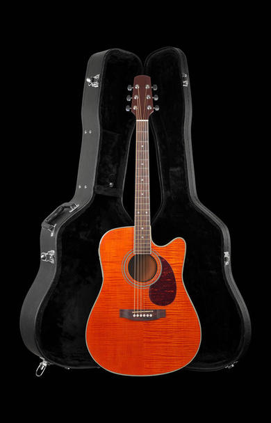 Musical instrument - Front view orange electro acoustic cutaway guitar in hard case  isolated on a black background. - Photo, Image