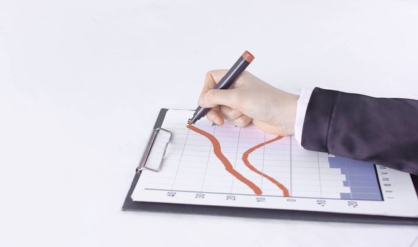 closeup .Businessman drawing a stock chart.isolated on white - Φωτογραφία, εικόνα