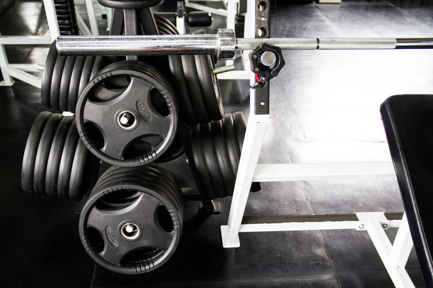 Close up of barbell with weight plates in the gym - Foto, Imagem