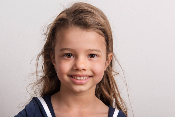 Portrait of a small girl in studio on a white background. - Fotoğraf, Görsel
