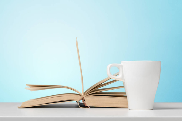 Pile of books with cup - Foto, imagen