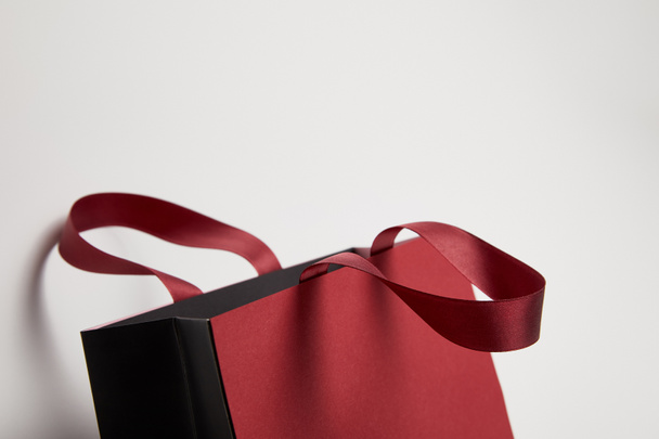 one new burgundy shopping bag on white - Φωτογραφία, εικόνα