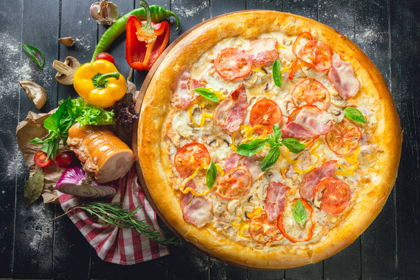 Pizza with dry cured ham and basil - Fotoğraf, Görsel