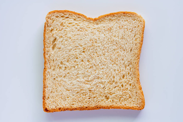 Sliced fine whole wheat bread on white background for food and eating concept - Foto, afbeelding