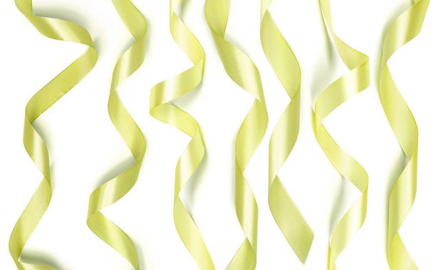 Golden ribbons on white background - Foto, Imagen