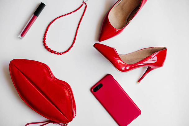 Red shoes, cosmetics and accessories. - Zdjęcie, obraz
