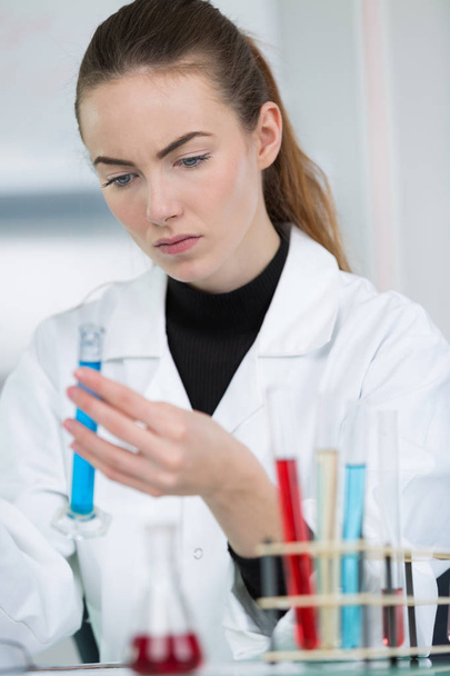 young female lab technician works on some samples - Foto, Bild