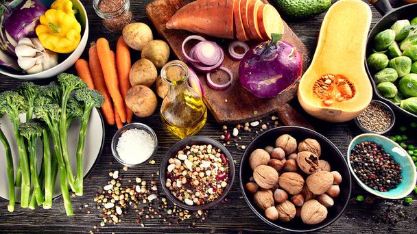 Food composition of fresh ingredients for healthy cooking on rustic wooden background. - Photo, Image