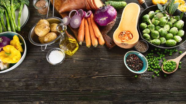 Still life of fresh ingredients for healthy cooking on rustic wooden background. - Photo, Image