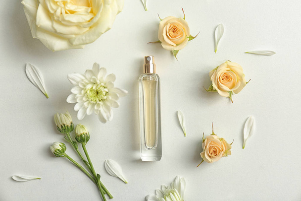 Beautiful composition with bottle of perfume on white background, flat lay - Fotoğraf, Görsel