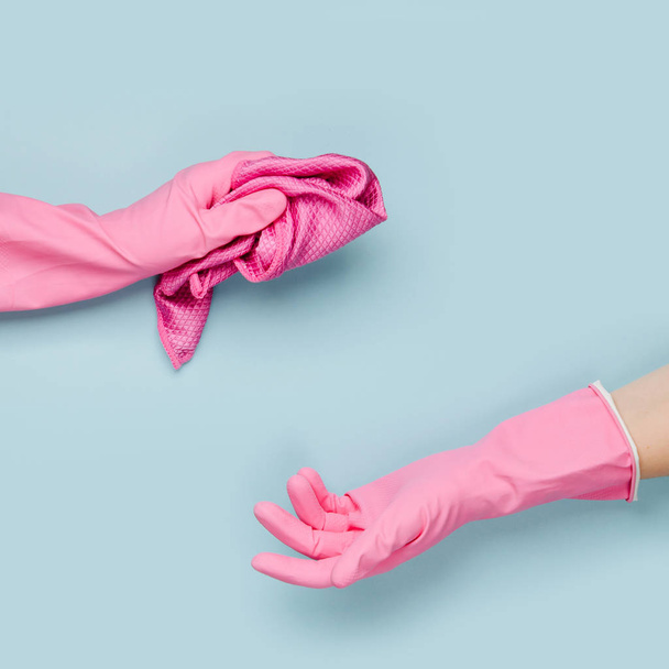 Female hands cleaning on blue background. Cleaning or housekeeping concept background. Copy space.  Flat lay, Top view. - Fotografie, Obrázek