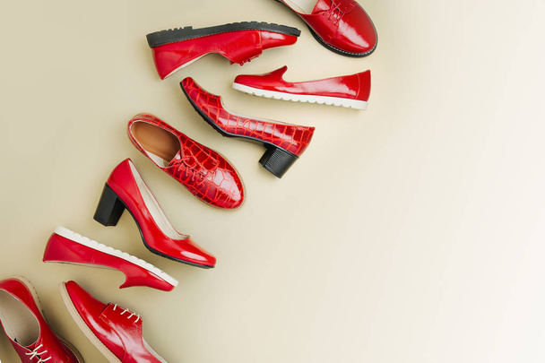 Stylish female spring or autumn shoes in red colors. Beauty and fashion concept. Flat lay, top view - Фото, зображення