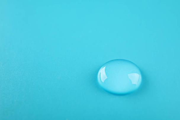 Beautiful clean water drop on color background - Foto, immagini