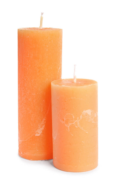 Two decorative wax candles on white background - Foto, Imagen