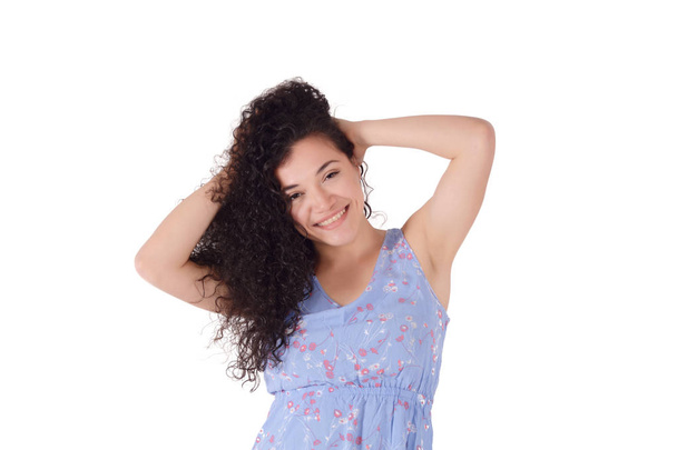 Portrait of attractive young latin woman in a studio. Isolated white background. - 写真・画像