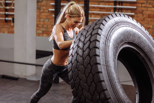 fit woman is keeping fit with wheel. active lifestyle - Foto, Imagem