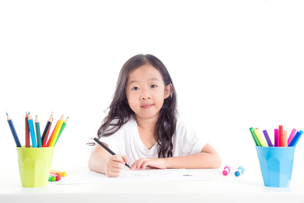Young asian girl drawing picture over white background - Fotografie, Obrázek