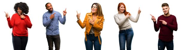 Group of cool people, woman and man pointing away side with finger - Photo, Image