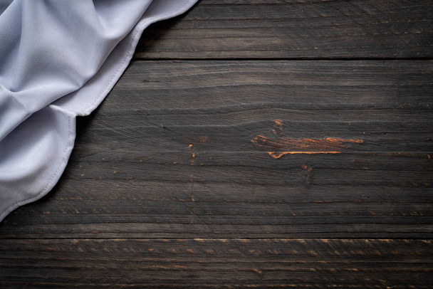 kitchen cloth (napkin) on wood background - vintage effect filter - Fotoğraf, Görsel