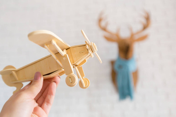 toy airplane in hand on background,close up - Photo, image