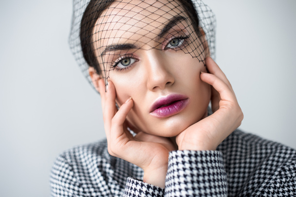 beautiful girl with makeup posing in jacket and vintage net veil, isolated on grey - Φωτογραφία, εικόνα
