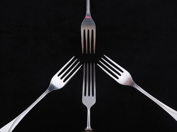 forks on a black background - Φωτογραφία, εικόνα