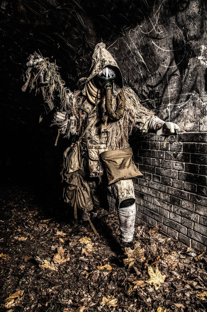 Post apocalyptic creature in gas mask armed gun - Photo, Image