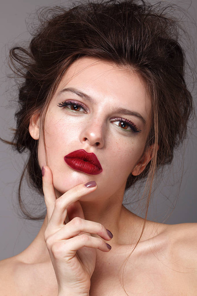 Portrait of beautiful glamorous brunette woman with bright make up and stylish hairdress. Red lips - Zdjęcie, obraz