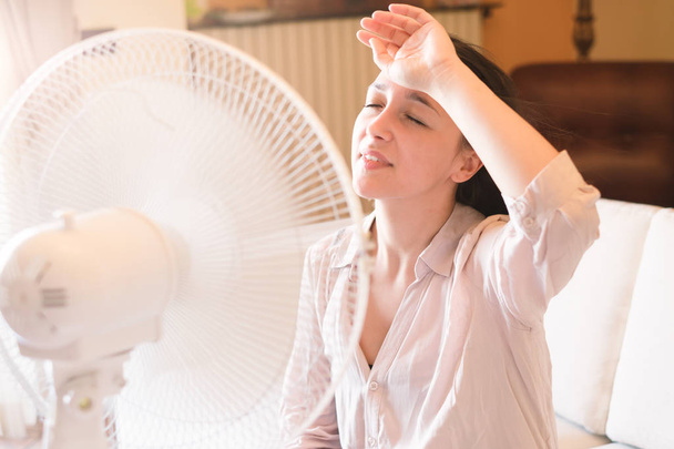 Young stressed woman sweating in the summer heat - Photo, Image