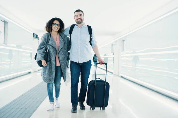 Young couple with a suitcase ready for traveling - Photo, Image