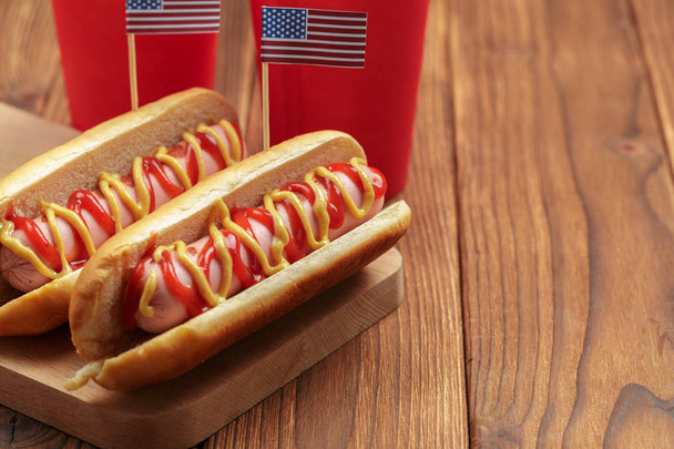 Hot dogs on wooden background - Fotó, kép