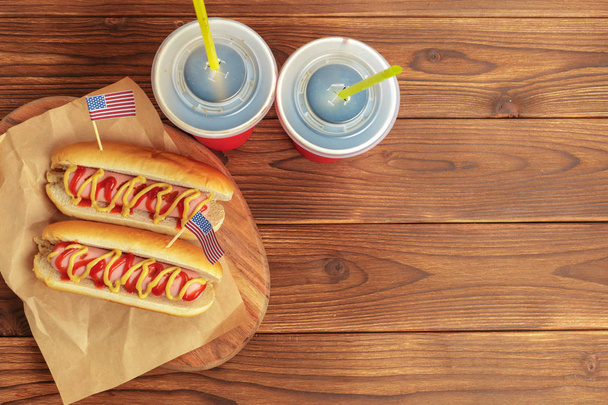 Hot dogs on wooden background - Foto, imagen