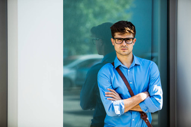 handsome office man next to an office building, going to work, young antrepreneur - Fotografie, Obrázek