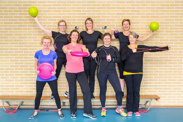 Group photo women gym class with sport equipment in gym - Photo, Image