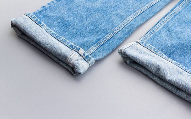 Jeans on grey background - Photo, Image