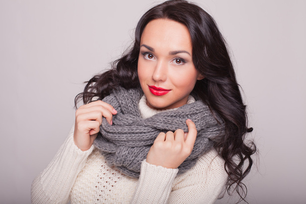 the beautiful girl in a scarf and a warm sweater with red lips - Foto, immagini