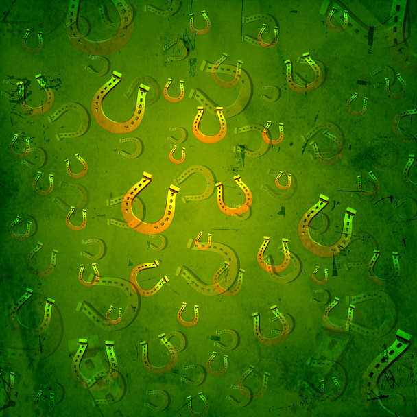 золотые подковы на зеленом бумажном фоне
 - Фото, изображение