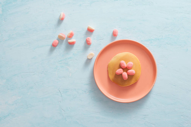 Children's breakfast or dessert - pancake with marshmallow candies.  - Valokuva, kuva