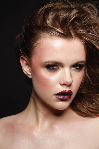 studio fashion portrait of young girl with dark make up on black background. - Zdjęcie, obraz