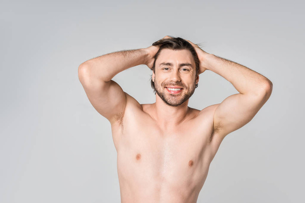 portrait of smiling shirtless man with stylish hairstyle isolated on grey - Фото, изображение