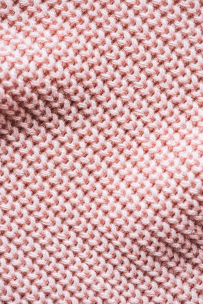 full frame image of pink knitted woolen fabric background - Foto, Bild