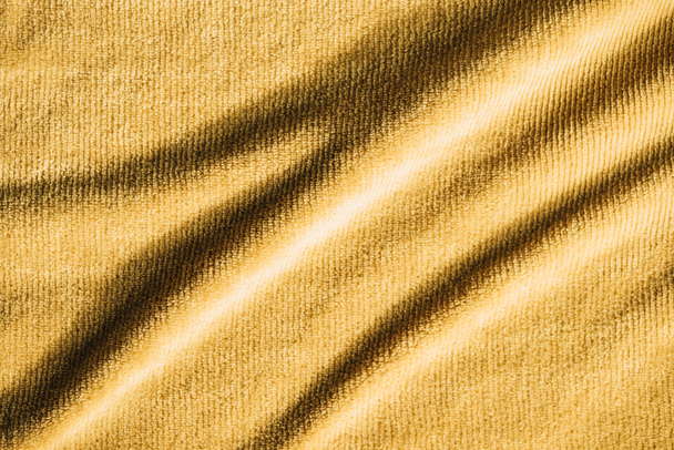 full frame image of yellow crumpled terry fabric background - Photo, Image