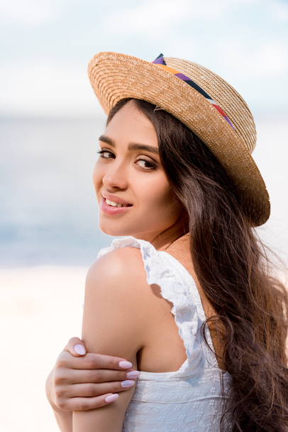 happy attractive brunette woman posing in straw hat - Photo, image