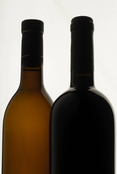 Two bottles of wine, wine drop, black - Zdjęcie, obraz