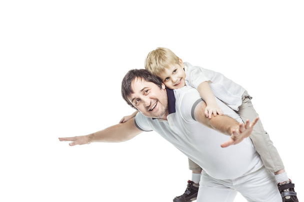 concept of childrens happiness: happy father playing with his five year old son - Foto, afbeelding